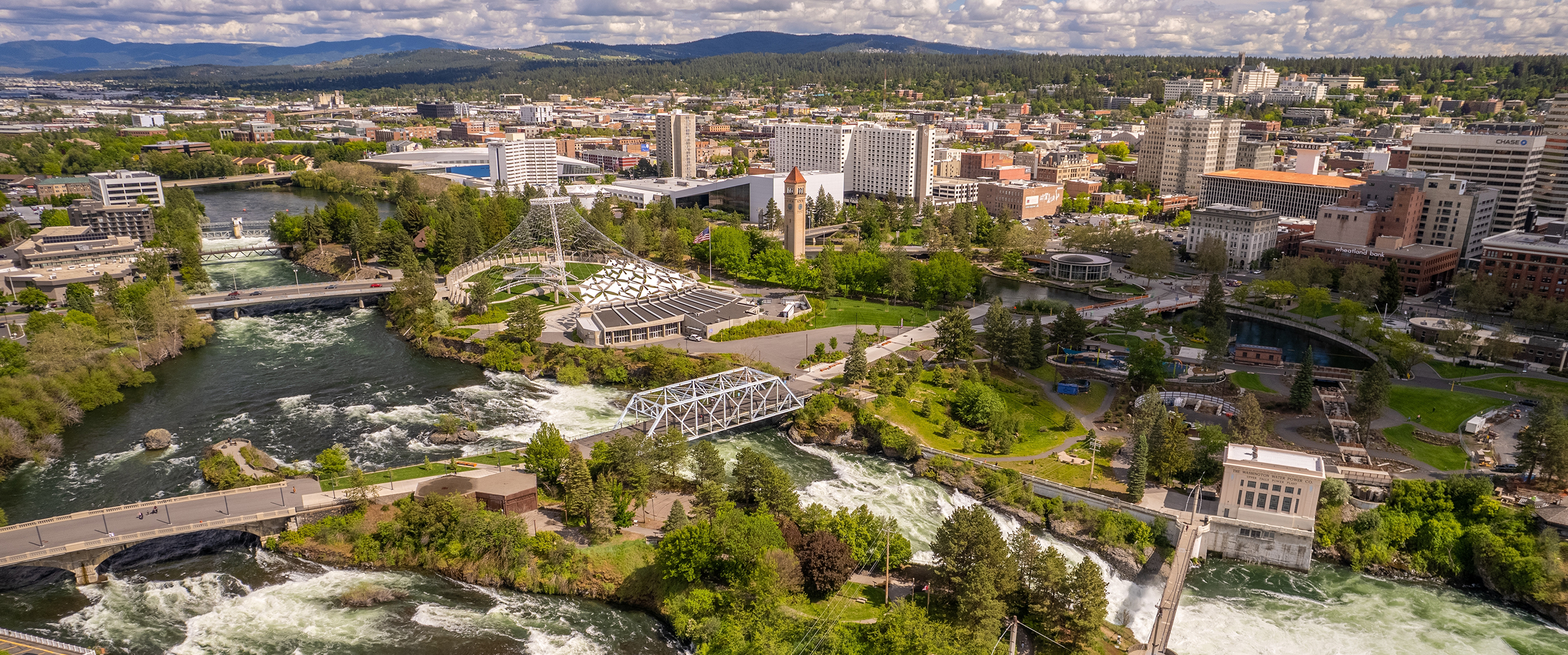 aerial view of Spokane, WA, featuring Riverfront Park and the Spokane River