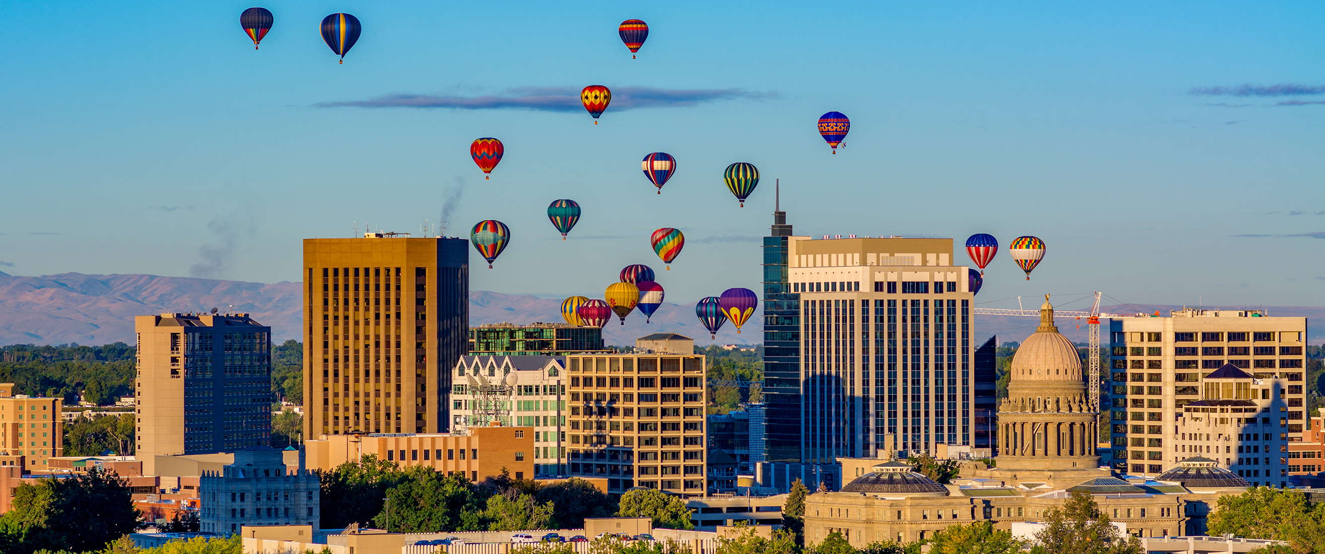 Capital and skyline of Boise Idaho with balloons in flight